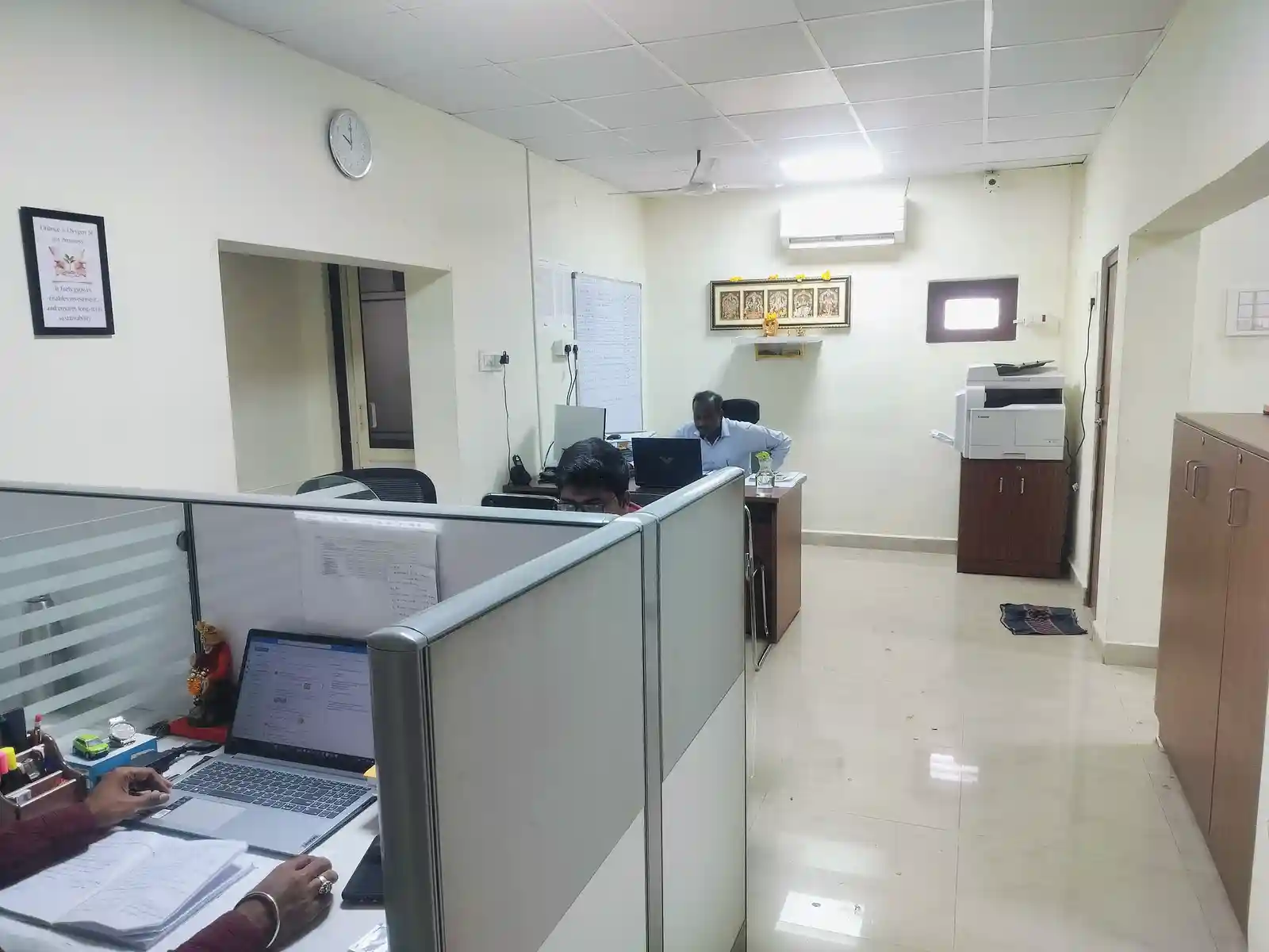 Corporate office workspace with desks and systems for internal skills development.