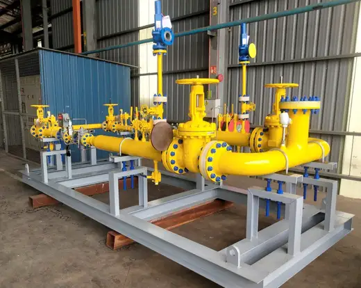 Manufactured industrial gas piping and modular skid assembly at a workshop.